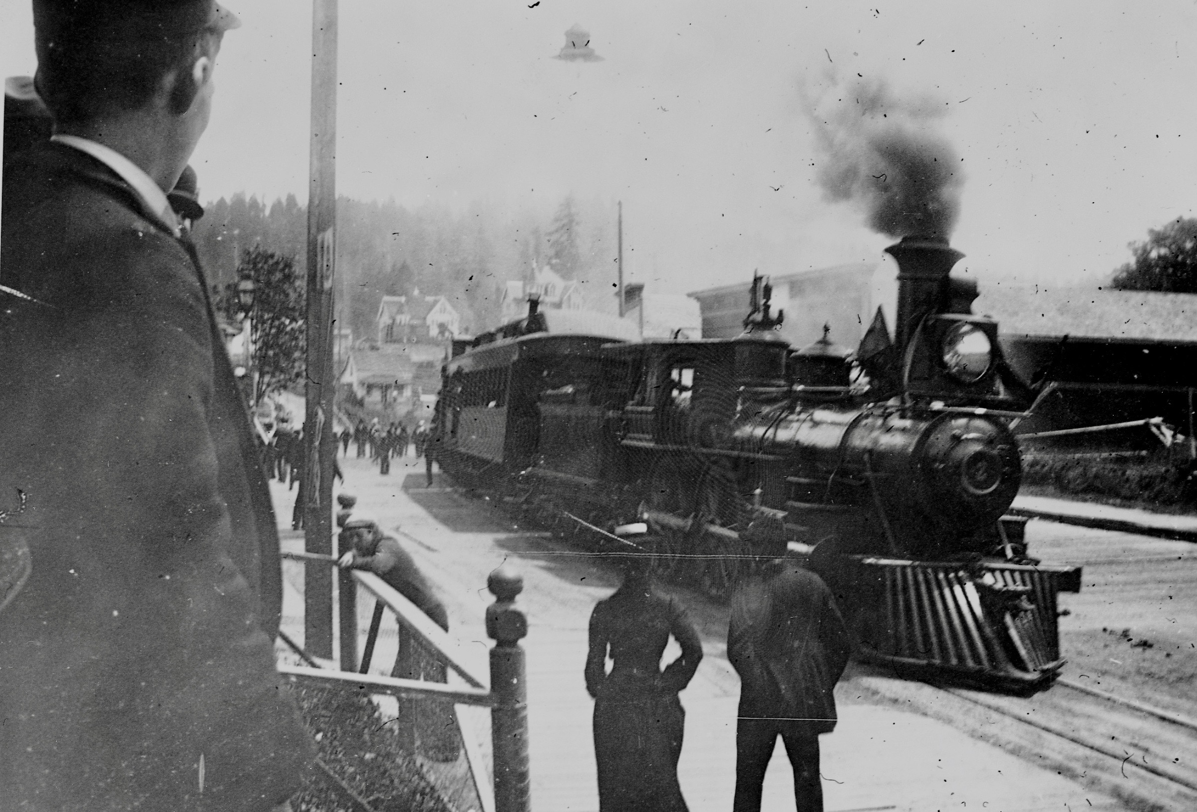 This photo was taken from the steps of the Hotel Coquille.  In 1910 the tracks were relocated to the waterfront.