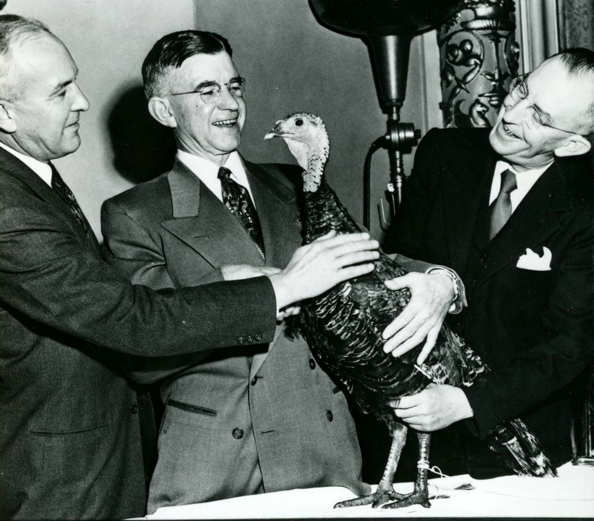 McKay wins a turkey from Langlie in the "Keep Green" contest, an effort to prevent forest fires in the Northwest. Oregon had fewer fires that year.