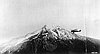 Fire patrol airplane circling Mt. Jefferson, Willamette National Forest, 1920